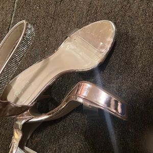 Cute gold and clear heels with rhinestones.